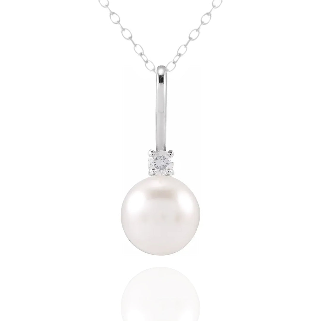 Pearl necklace with a diamond pendant on a white background - Pearl Anniversary Gift