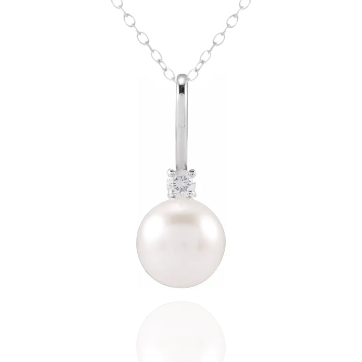 Pearl necklace with a diamond pendant on a white background - Pearl Anniversary Gift