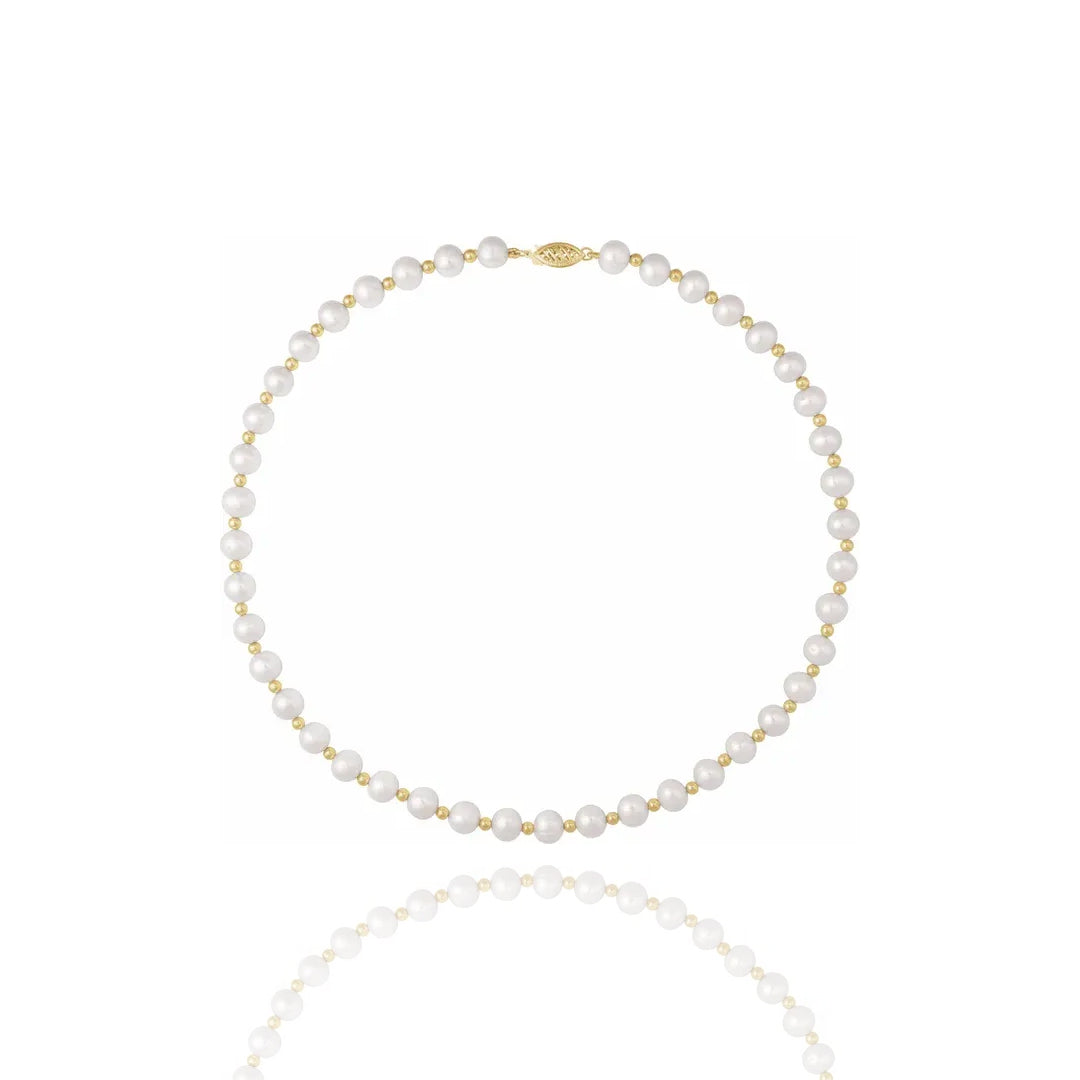 Pearl necklace with gold accents on a white background - Anniversary Gift
